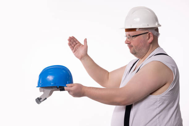 Business man in orange helmet shirt construction security professionals. High quality photo