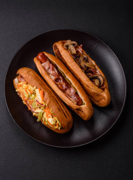 istock Hotdog with grilled sausage with cabbage, carrots and onions 2184200557
