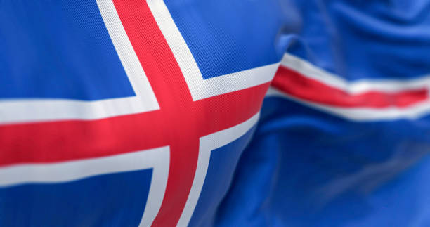 istock Close-up of three Iceland national flags waving 2184200982