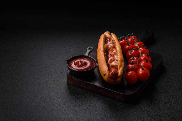 istock Hotdog with grilled sausage with bacon and mushrooms 2184201559
