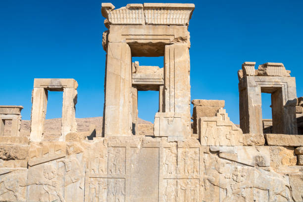 istock Persepolis, beautiful stone archway stands tall with a blue sky, Iran 2184201706