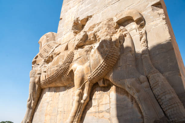 istock Persepolis, beautiful stone archway stands tall with a blue sky, Iran 2184203236