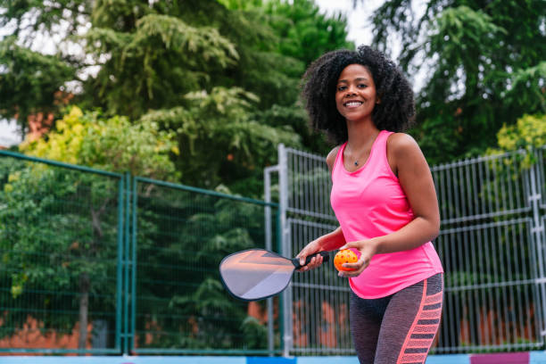 istock Young afro black woman playing pickleball outdoors on sunny day 2184203813