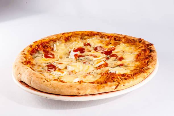istock A pizza with cheese and tomato sauce sits on a white plate 2184210684