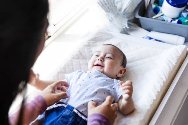 istock Loving mom tickles her baby boy 2184214691