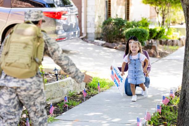 istock Excited girl greets dad upon his return from military service 2184214733