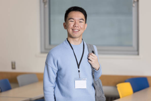 istock A young student is standing in a classroom with a name tag 2184217084
