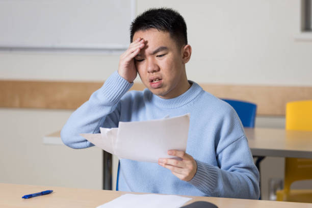 istock A young university student is disappointed about his exam grades 2184217438