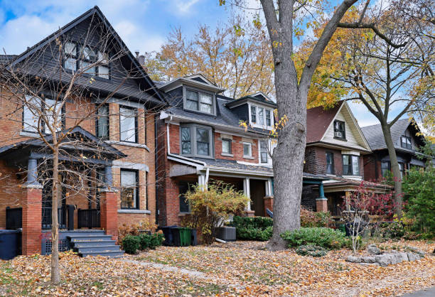 istock Residential street in fall 2184217805
