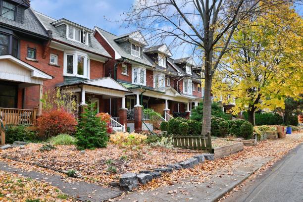 istock Residential street in fall 2184217815