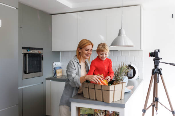 istock Mother and daughter creating healthy cooking content together 2184218659
