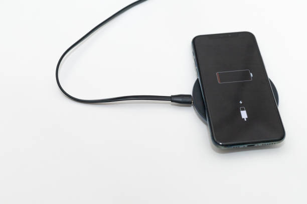 istock the phone is charged by wireless charging 2184223056