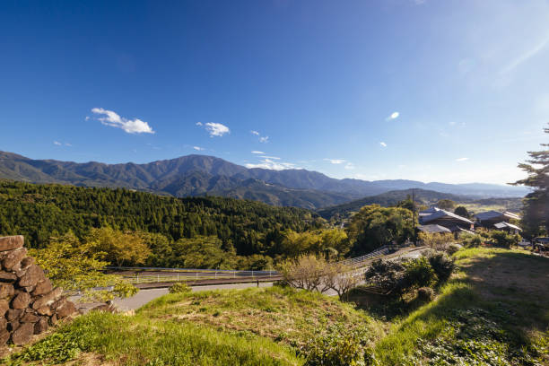 Hiking path landscape on the famous Magome-Tsumago Trail as part of the Nakasendo Way between Magome and Tsumago in Gifu Prefecture, Japan