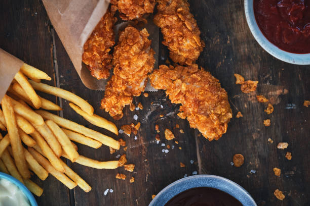 istock Crispy Fried Chicken Drumsticks with French Fries 2184224515