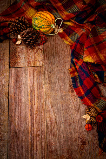 istock Autumn decorations on a wood textured background with copy space 2184224522