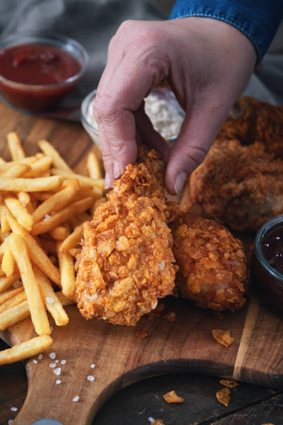istock Crispy Fried Chicken Drumsticks with French Fries 2184224636