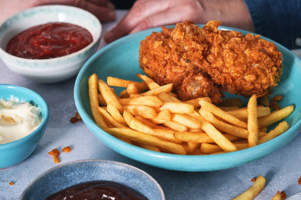 istock Crispy Fried Chicken Drumsticks with French Fries 2184224833