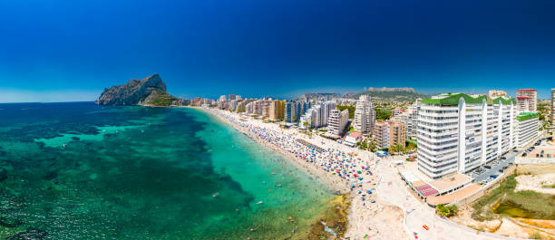 istock Mediterranean beach. Mountain Penyal d'Ifach. Calpe beach, Spain. 2184225253