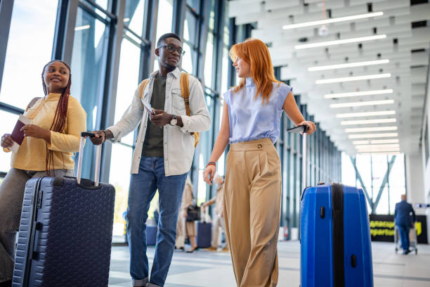 istock Diverse group traveling together through airport. 2184229061
