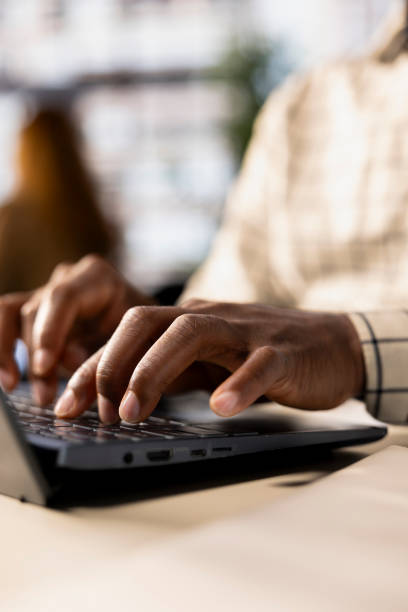 istock Skilled businessman at his office desk working on report writing 2184229175