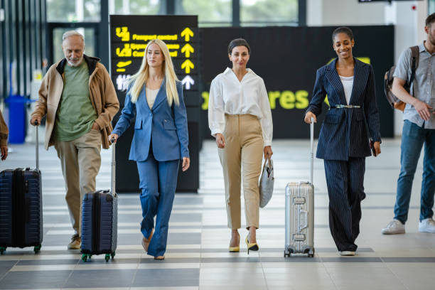 istock Diverse travelers stride confidently through airport lobby. 2184229309