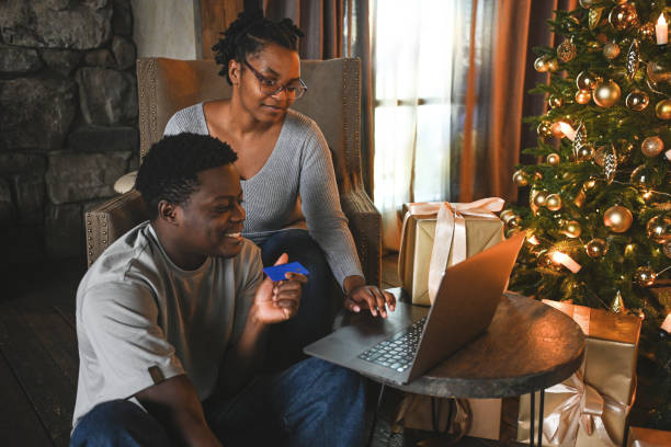 istock young couple doing christmas shopping online 2184230944