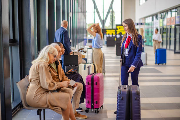 istock Group of diverse travelers interacting with airline staff 2184231979