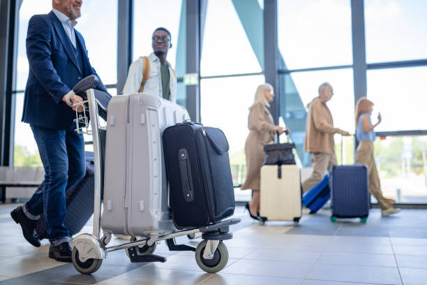 istock Individuals touring modern airport terminal corridor 2184232595