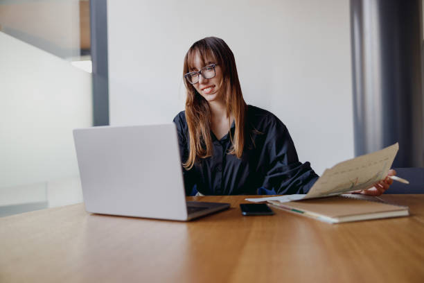 istock A Professional Woman Actively Working on Her Laptop in a Stylish Modern Office Environment 2184233967