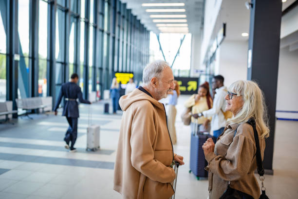 istock Mature Pair Engaging at Spacious Modern Airport 2184235334