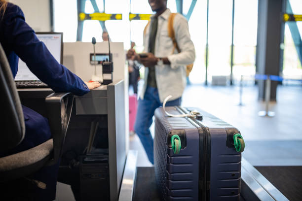 istock Passenger strolls away from airport counter calmly. 2184235718