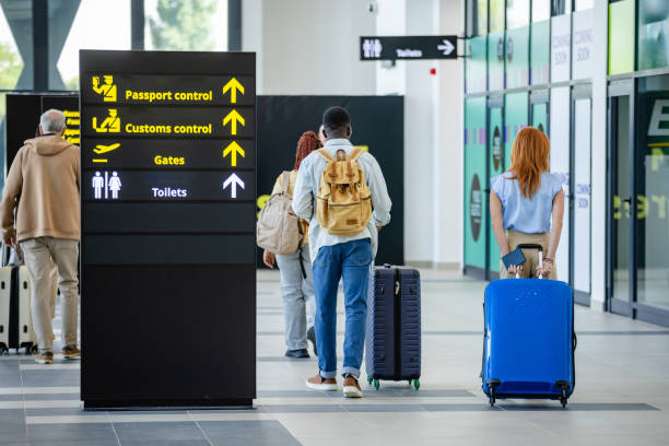 istock People walking towards passport control and customs. 2184236120