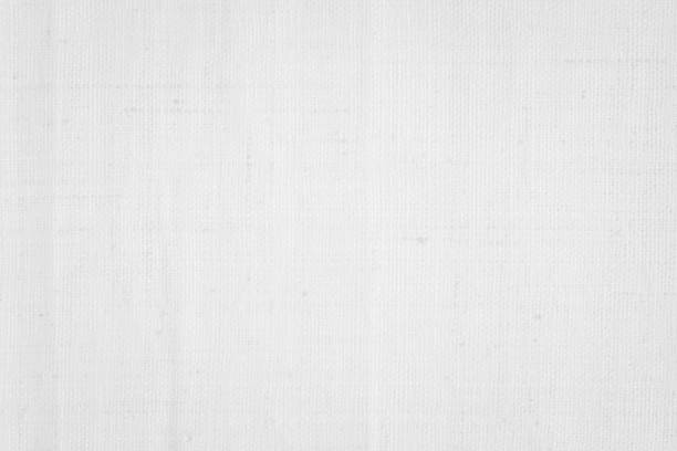 istock White color fabric canvas woven texture background in pattern light blank. Natural gauze linen, carpet wool and cotton cloth textile textured as clean empty for decoration text. Grey sack material. 2184238033
