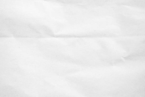 istock White recycled craft paper texture as background. Grey paper texture, Old vintage page or grunge vignette of old newspaper. Pattern rough art creased grunge letter. Hardboard with copy space for text. 2184238206