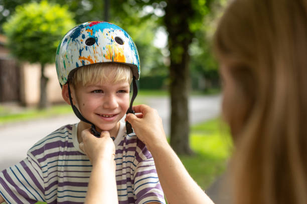 istock Caucasian Mother Prepares Son for Cycling 2184238760