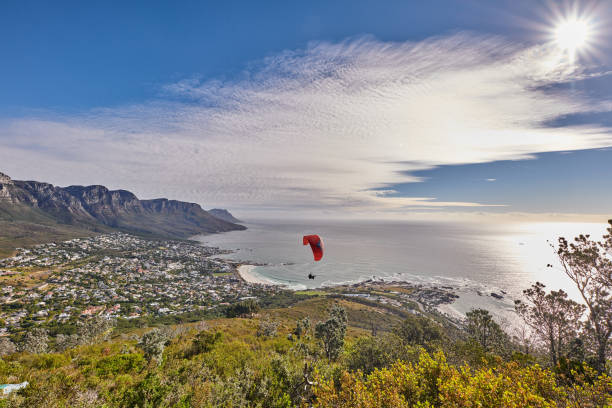 istock Paraglider soaring in the sky 2184238872