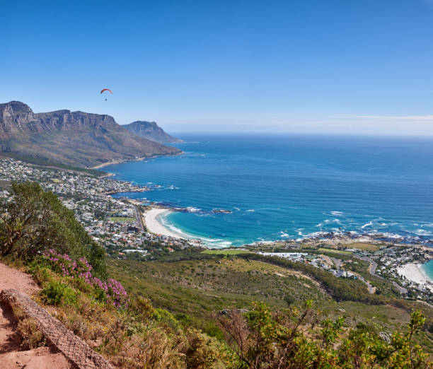 istock Paraglider soaring in the sky 2184238898