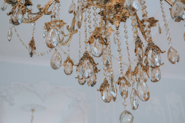 istock Elegant chandelier adorned with crystal drops in a bright interior space 2184239786