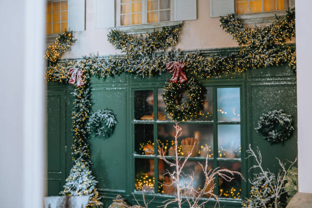 istock Decorative winter storefront adorned with festive garlands and wreaths 2184239877