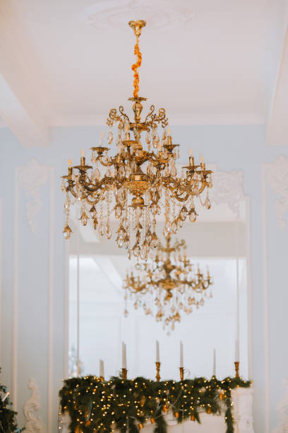 istock Elegant chandeliers adorned with crystals illuminating a festive interior space 2184239883