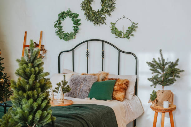 istock Cozy bedroom decorated with greenery and festive elements during winter 2184239948