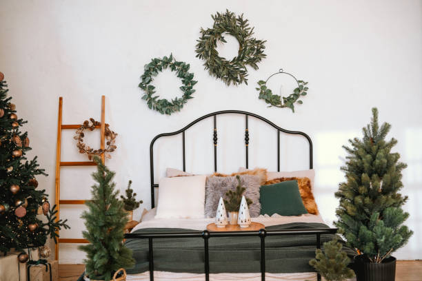 istock Cozy holiday bedroom with festive decorations and greenery in December 2184239962