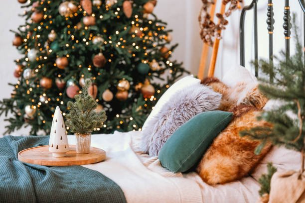 istock Cozy bedroom with a Christmas tree and festive decorations during the holidays 2184239973