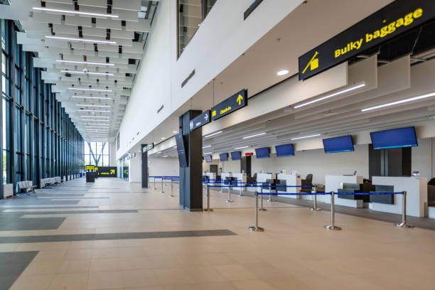 istock Spacious modern airport check-in counter area view 2184240118