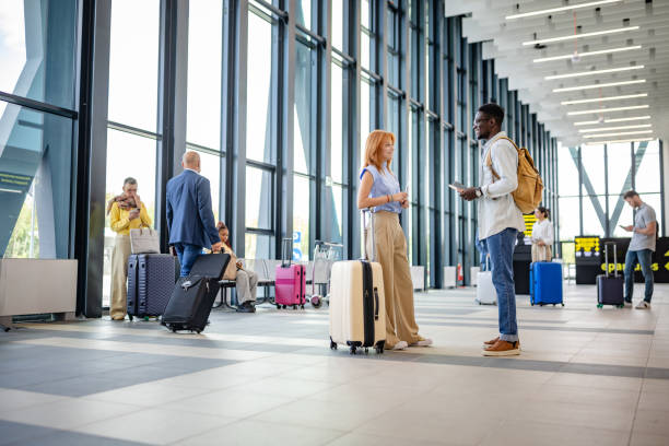 istock Travel talk between two with suitcases at airport 2184240760