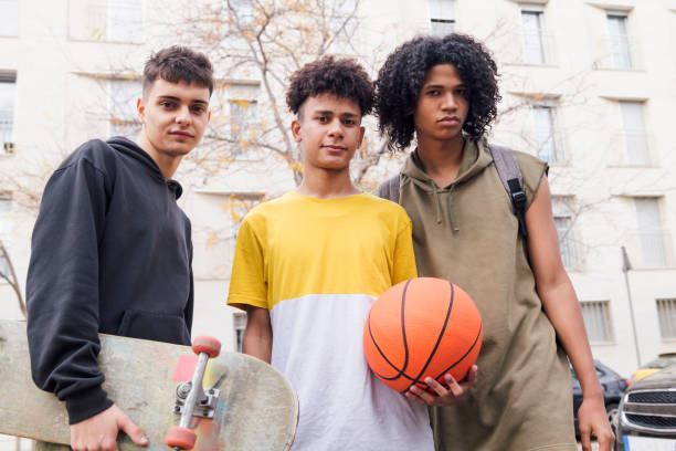 istock three teenager friends together looking at camera 2184240811