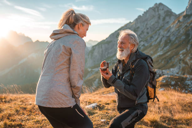istock Hiking And Romantic Mature Couples Proposal In Nature 2184241021