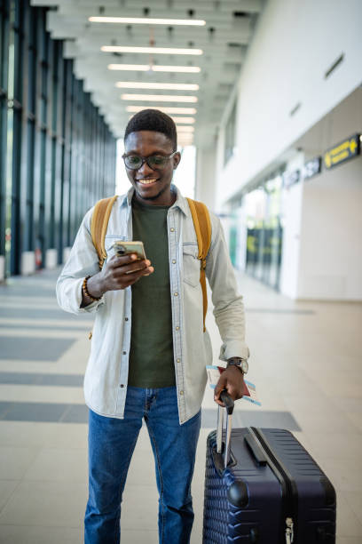 istock Traveler holding boarding pass and checking phone. 2184241212