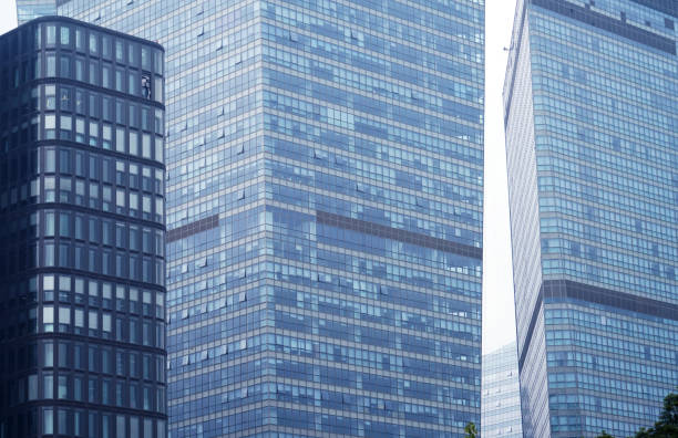 close up on modern office building skyscraper with blue glass wall