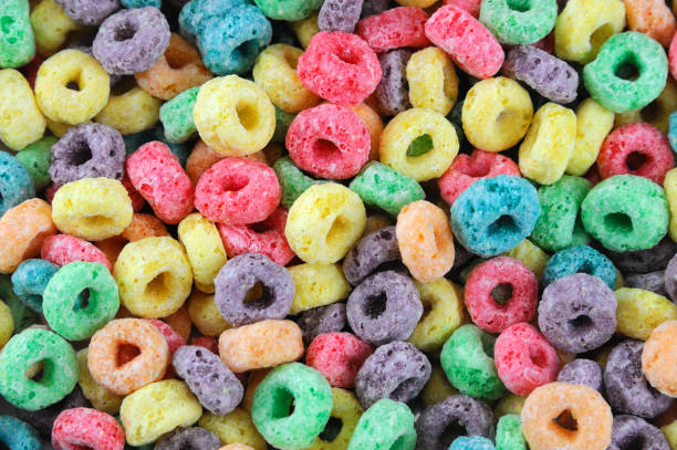 istock Colorful cereal loop rings, breakfast food background 2184247491
